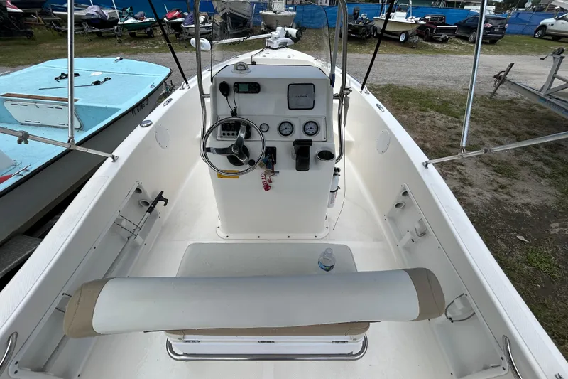 Slide: The Image of 2014 Key West 176 Sportsman CC boat interior with steering console and seating. - 15