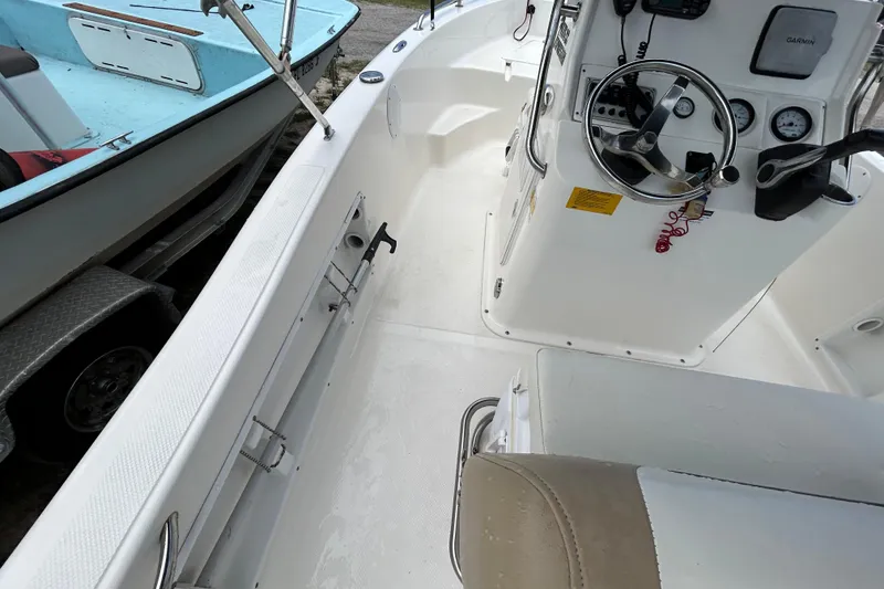 Slide: The Image of 2014 Key West 176 Sportsman CC boat interior with steering console and seating. - 16