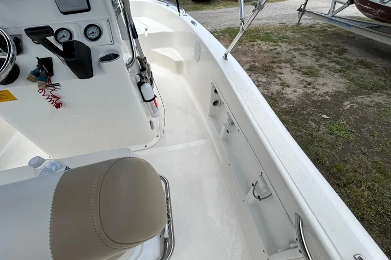 Slide: The Image of 2014 Key West 176 Sportsman CC boat interior with steering console and seating. - 17