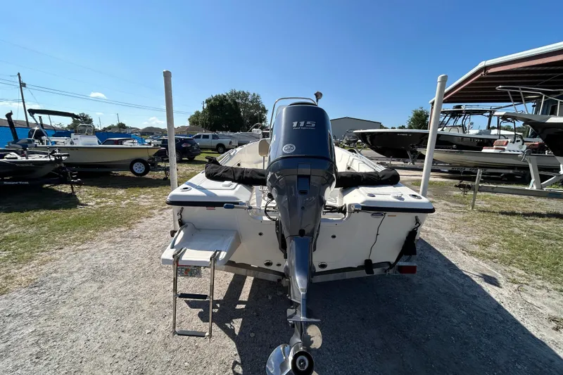 Slide: The Image of 2014 Key West 176 Sportsman CC boat with 115 horsepower engine, parked outdoors. - 3