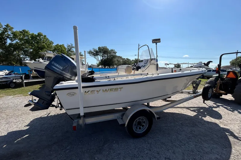 Slide: The Image of 2014 Key West 176 Sportsman CC boat on trailer, featuring Yamaha outboard motor. - 4