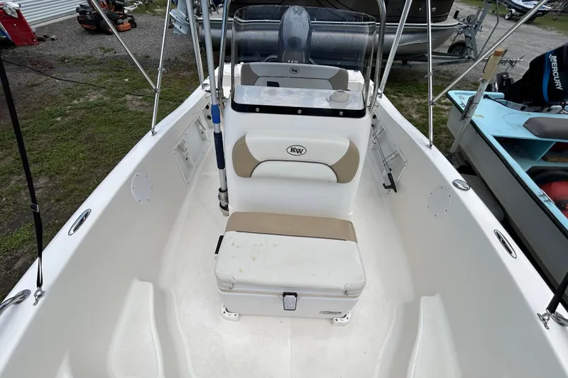 Slide: The Image of 2014 Key West 176 Sportsman CC boat interior with seating and console. - 8