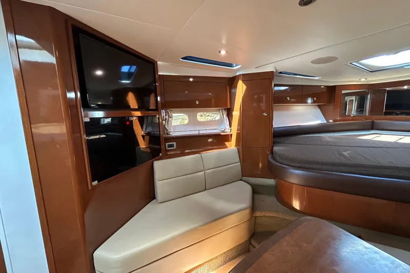 Slide: The Image of Luxurious interior of 2014 Sea Ray Sundancer 350 yacht with seating and entertainment area. - 13