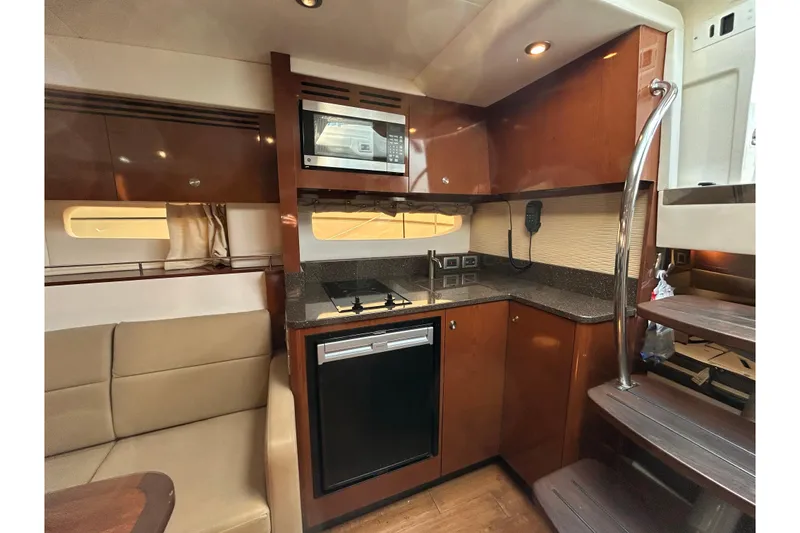 Slide: The Image of Luxurious 2014 Sea Ray Sundancer 350 yacht interior with modern kitchen amenities. - 12