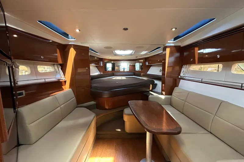 Slide: The Image of Luxurious interior of 2014 Sea Ray Sundancer 350 yacht with elegant seating and wood finishes. - 11