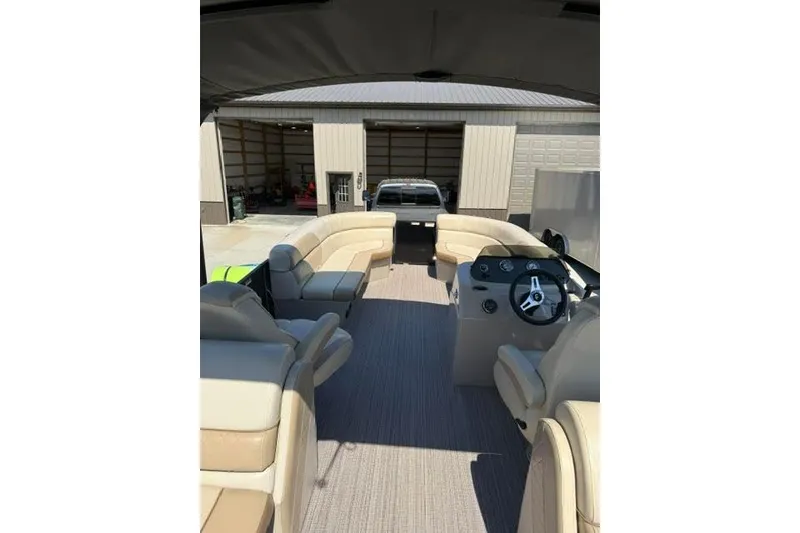 Slide: The Image of Interior view of 2022 Veranda Vista View22RC TT pontoon boat with beige seating. - 11