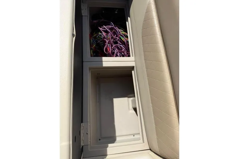 Slide: The Image of Storage compartment in 2022 Veranda Vista View22RC TT with colorful ropes inside. - 14