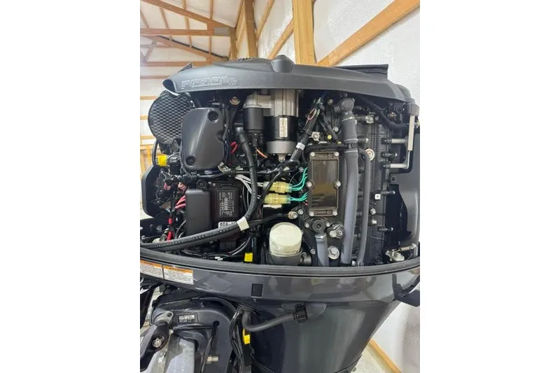 Slide: The Image of Close-up of a 2022 Veranda Vista View22RC TT boat engine in a garage. - 17