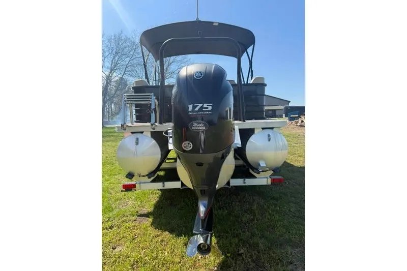 Slide: The Image of 2022 Veranda Vista View22RC TT pontoon boat with Yamaha 175 engine, parked on grass. - 4