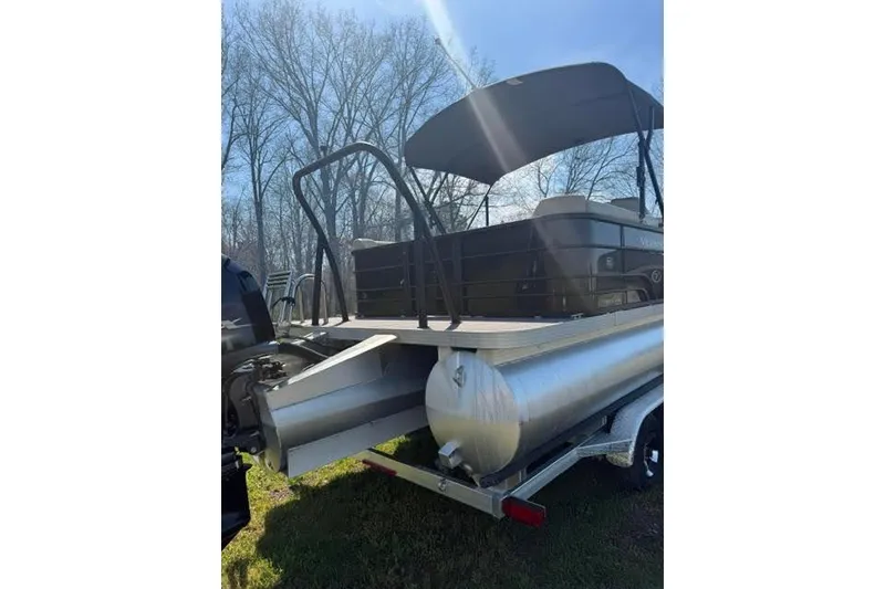 Slide: The Image of 2022 Veranda Vista View22RC TT pontoon boat with canopy on trailer, outdoors. - 5