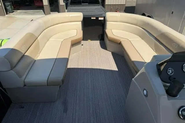 Slide: The Image of 2022 Veranda Vista View22RC TT pontoon boat with spacious beige seating and modern interior design. - 7