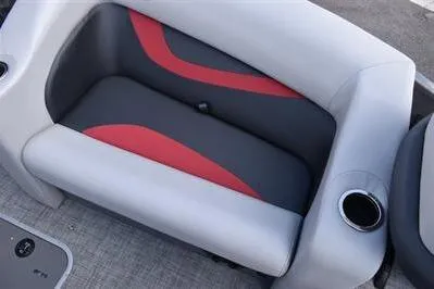 Slide: The Image of 2026 Princecraft Ventura 194 boat seat with gray and red upholstery, featuring a built-in cup holder. - 12