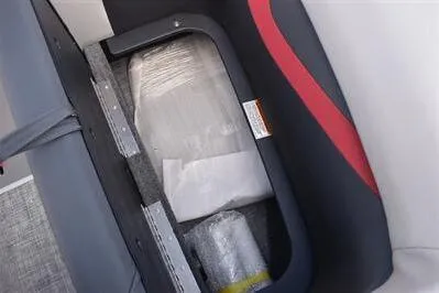 Slide: The Image of 2026 Princecraft Ventura 194 boat seat storage with red and gray upholstery. - 13