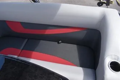 Slide: The Image of 2026 Princecraft Ventura 194 boat interior with red and gray seating and cup holder. - 18