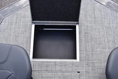 Slide: The Image of 2026 Princecraft Ventura 194 boat storage compartment with gray textured flooring. - 9