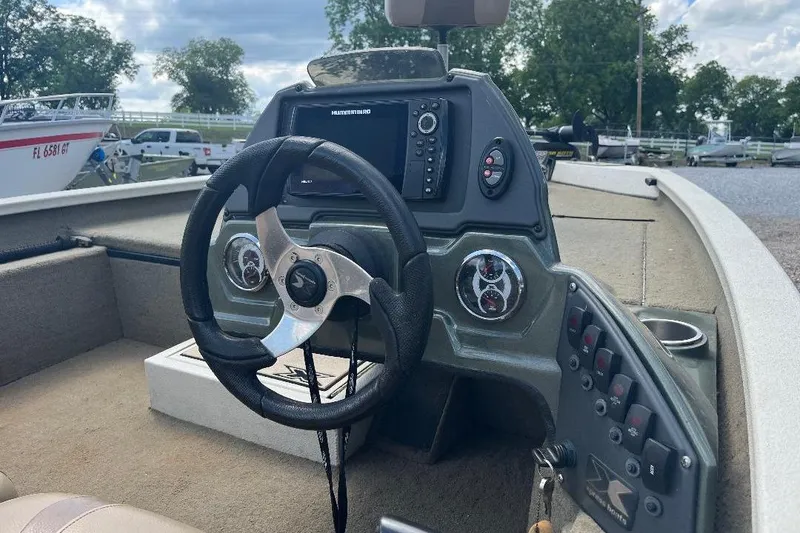 Slide: The Image of Steering console of 2018 Xpress X17 Pro boat with navigation controls and gauges. - 10