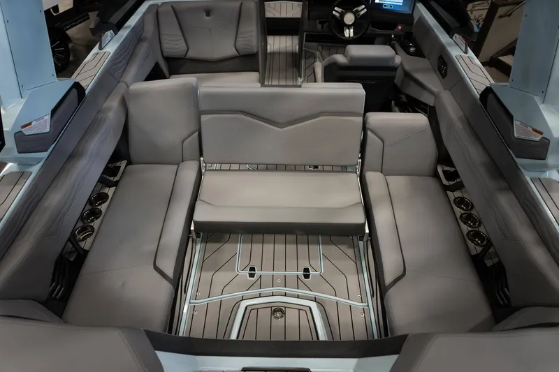 Slide: The Image of 2026 Nautique G23 interior with luxurious gray seating. - 11