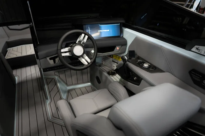 Slide: The Image of 2026 Nautique G23 interior with modern steering wheel and display. - 13