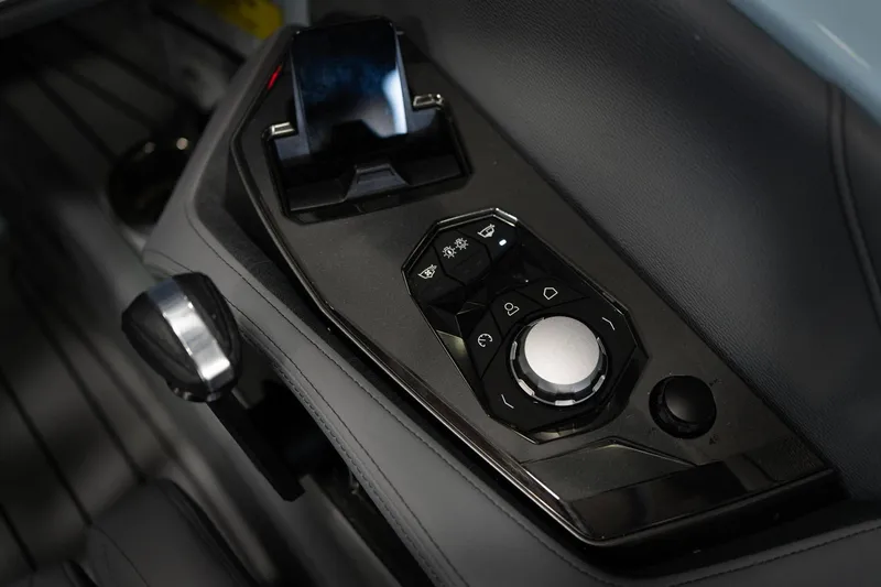 Slide: The Image of 2026 Nautique G23 boat control panel with modern controls. - 14