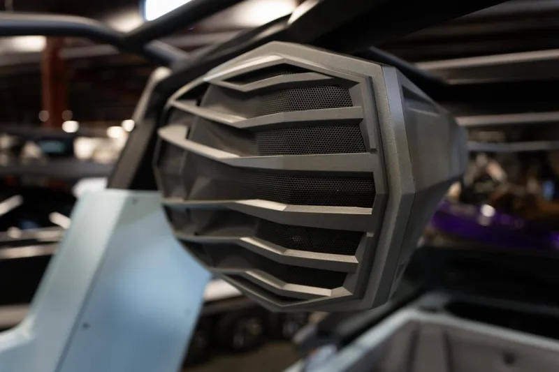 Slide: The Image of Close-up of a speaker on a 2026 Nautique G23 boat. - 18