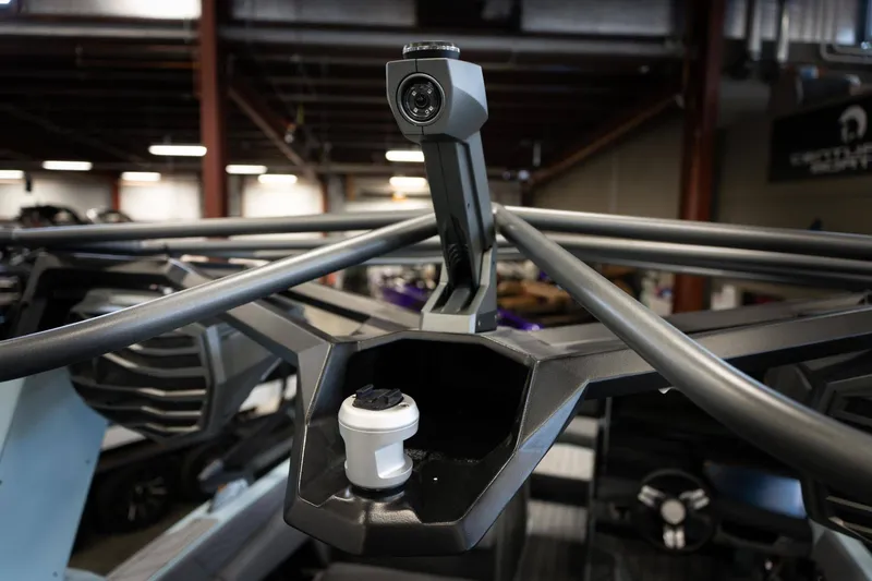 Slide: The Image of 2026 Nautique G23 boat with camera and cup holder. - 21