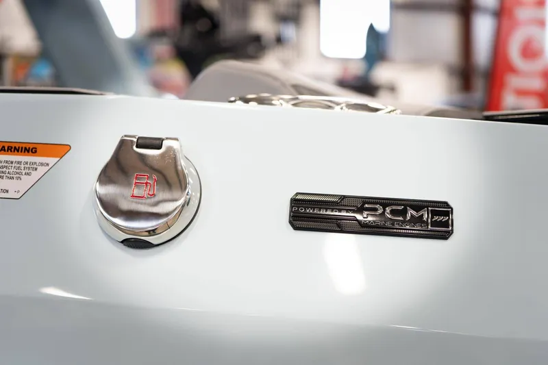 Slide: The Image of 2026 Nautique G23 boat with PCM engine badge. - 23