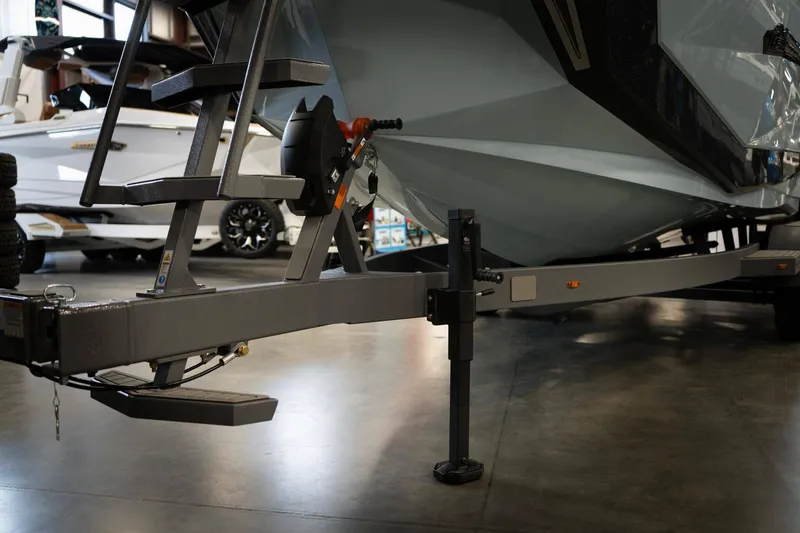Slide: The Image of Nautique G23 2026 boat trailer in a workshop. - 25