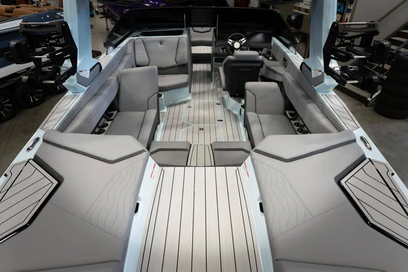 Slide: The Image of Interior of 2026 Nautique G23 boat with luxurious gray seating. - 9
