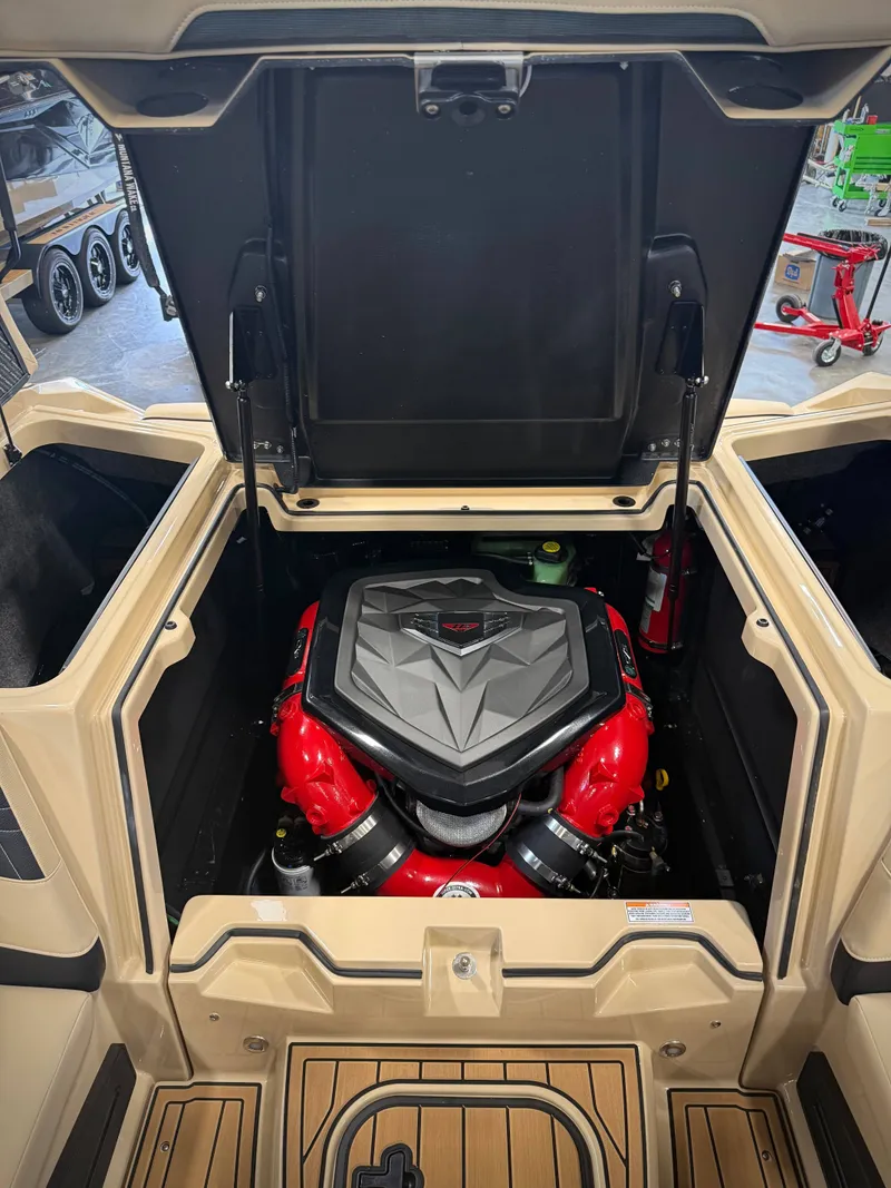 Slide: The Image of Engine compartment of the 2026 Nautique Super Air Nautique S23 boat. - 17