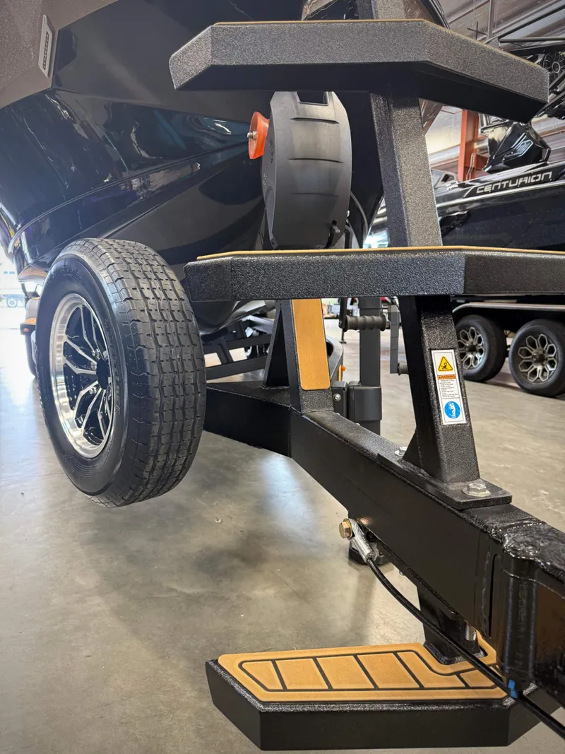 Slide: The Image of 2026 Nautique Super Air Nautique S23 boat trailer detail view. - 22