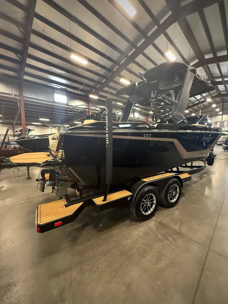 Slide: The Image of 2026 Nautique Super Air Nautique S23 in a warehouse setting. - 3