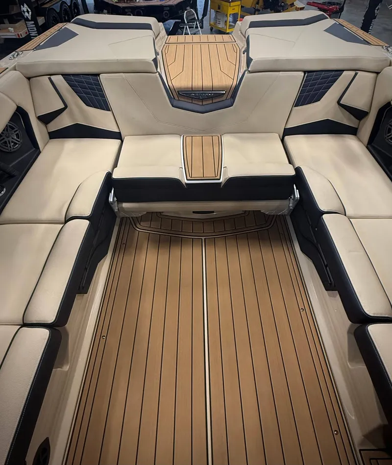 Slide: The Image of Interior of 2026 Nautique Super Air Nautique S23 with luxurious seating. - 8