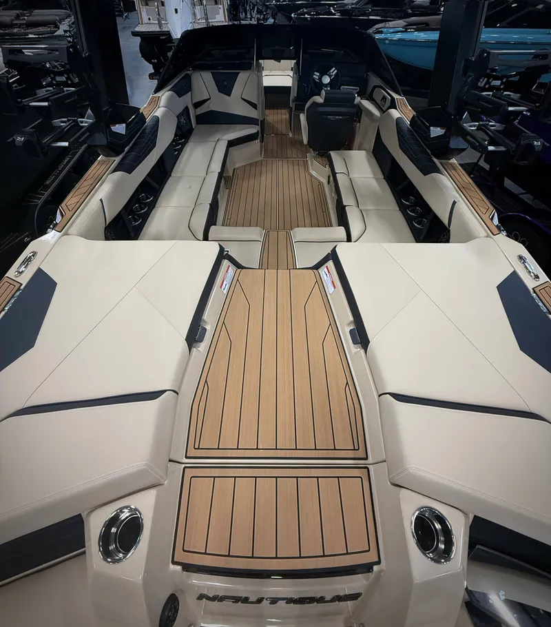 Slide: The Image of Interior of 2026 Nautique Super Air Nautique S23 with luxurious design. - 9
