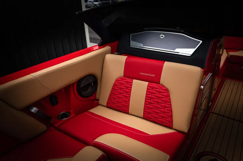 Slide: The Image of Interior of 2023 MasterCraft X24 with red and beige seating. - 15