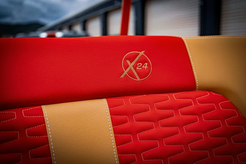 Slide: The Image of Close-up of red and yellow seat in MasterCraft X24 boat, 2023 model. - 18