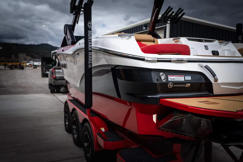 Slide: The Image of 2023 MasterCraft X24 boat on trailer, ready for adventure. - 5
