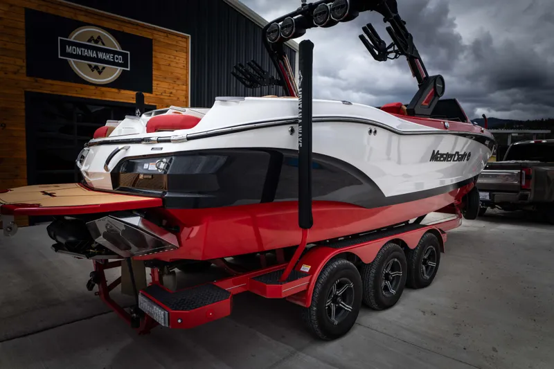 Slide: The Image of 2023 MasterCraft X24 boat on trailer at Montana Wake Co. - 6