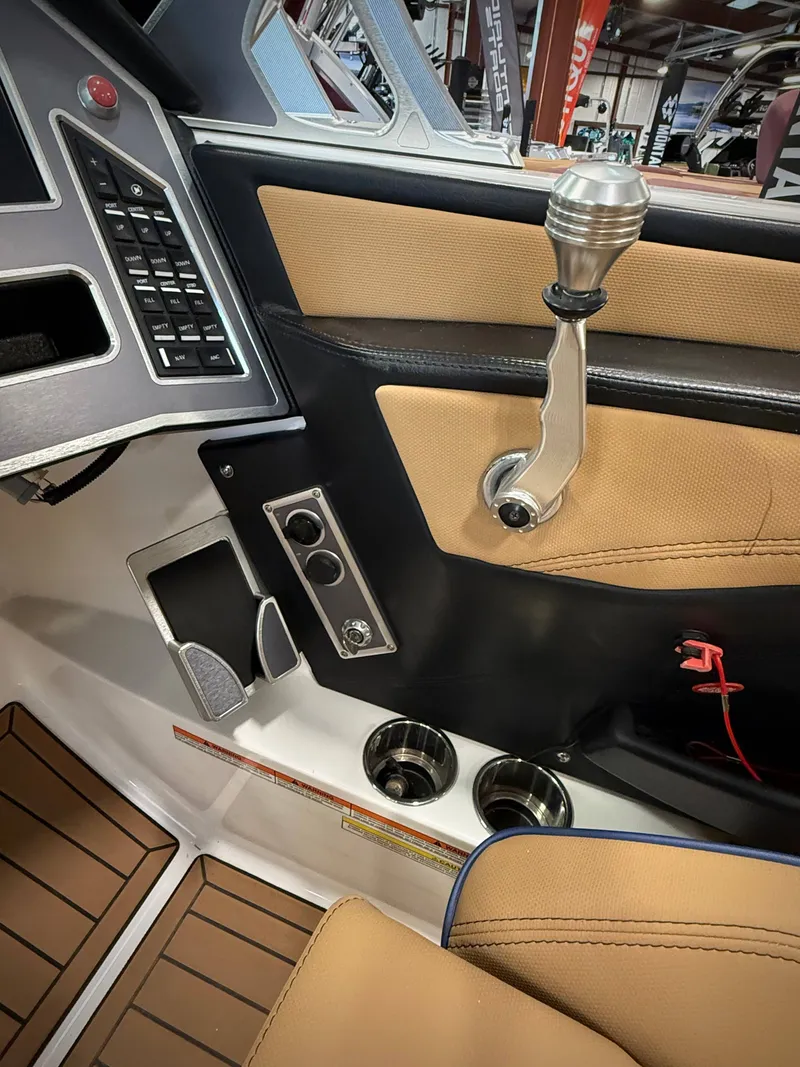 Slide: The Image of Interior of a 2021 MasterCraft XT22 boat with gear lever and controls. - 10