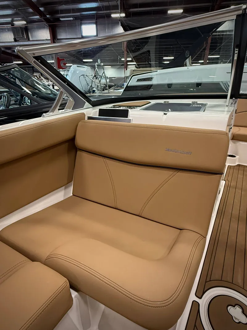 Slide: The Image of Interior of a 2021 MasterCraft XT22 with brown leather seats. - 13