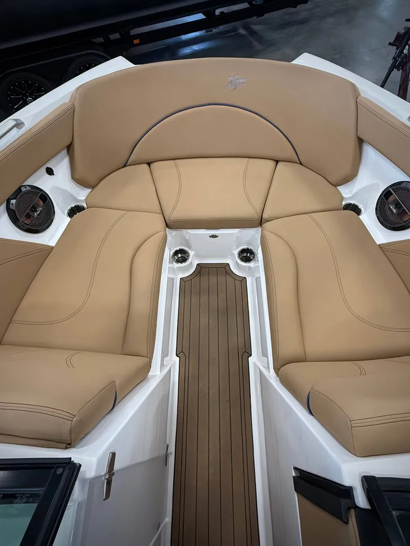 Slide: The Image of Interior of a 2021 MasterCraft XT22 boat with beige seating. - 16