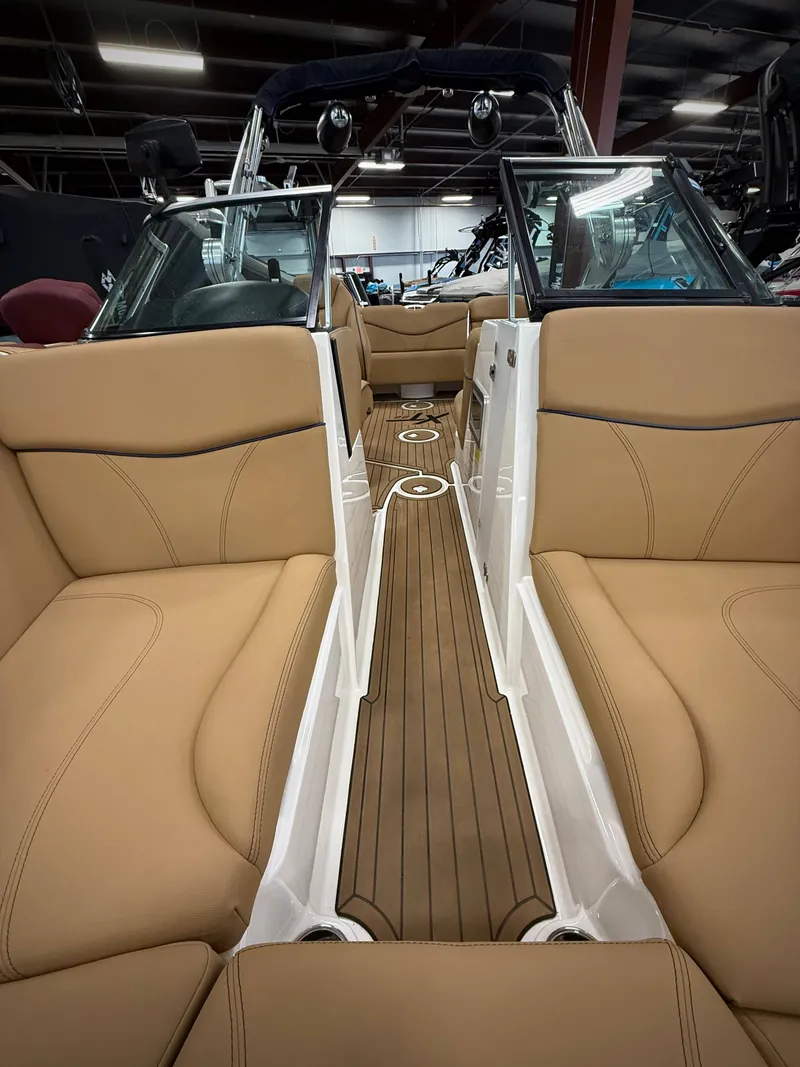 Slide: The Image of Interior of a 2021 MasterCraft XT22 boat with beige seating. - 17