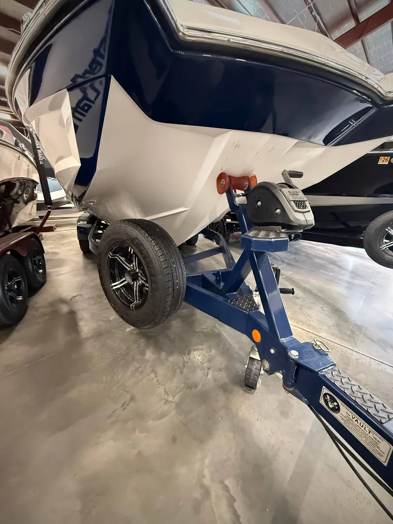 Slide: The Image of 2021 MasterCraft XT22 boat on trailer in warehouse. - 18