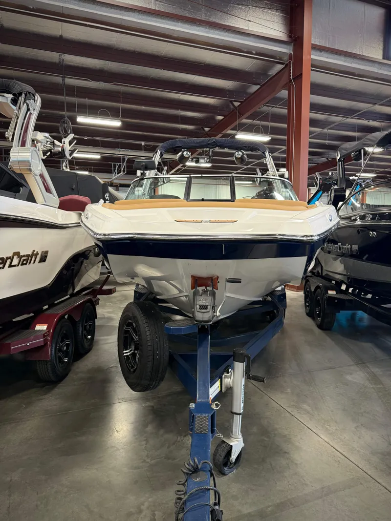 Slide: The Image of 2021 MasterCraft XT22 boat in warehouse on trailer. - 3