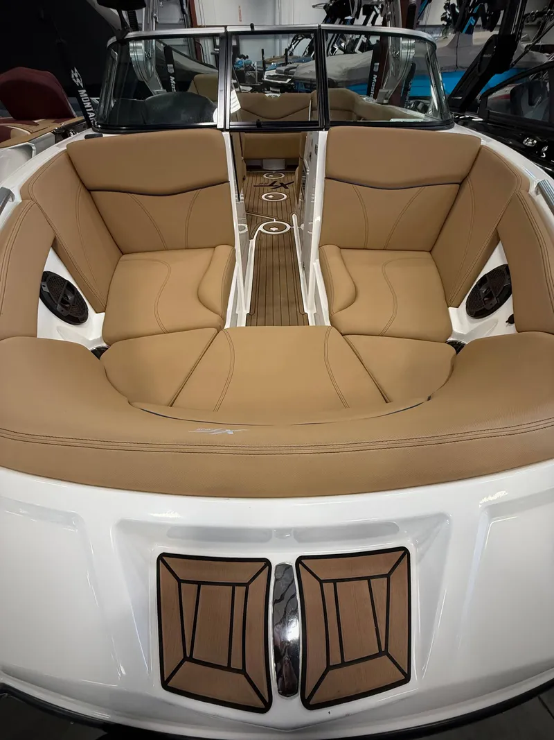 Slide: The Image of Interior of a 2021 MasterCraft XT22 boat with beige seating. - 7