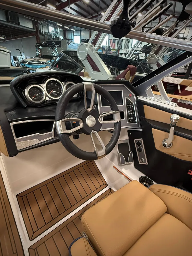 Slide: The Image of Interior of a 2021 MasterCraft XT22 boat with modern dashboard. - 8
