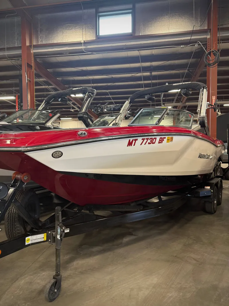 The Image of 2022 MasterCraft NXT24 boat in warehouse on trailer. - 1