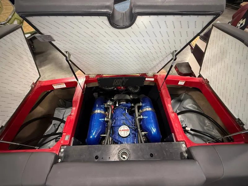 Slide: The Image of Engine compartment of 2022 MasterCraft NXT24 with blue engine. - 14