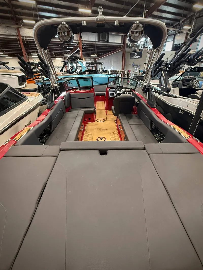 Slide: The Image of Interior view of a 2022 MasterCraft NXT24 boat in showroom. - 5