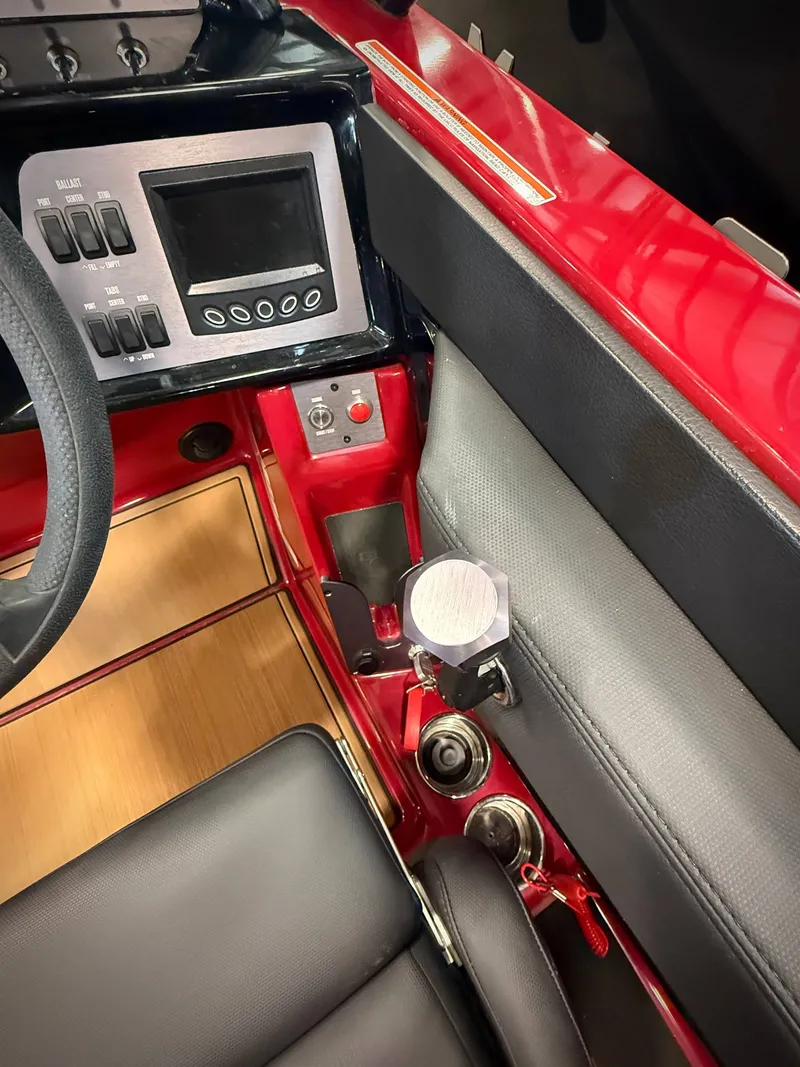 Slide: The Image of Interior of a 2022 MasterCraft NXT24 boat with control console. - 9