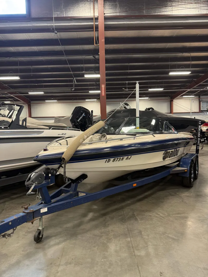 The Image of 1999 Malibu Response boat in warehouse on trailer. - 1